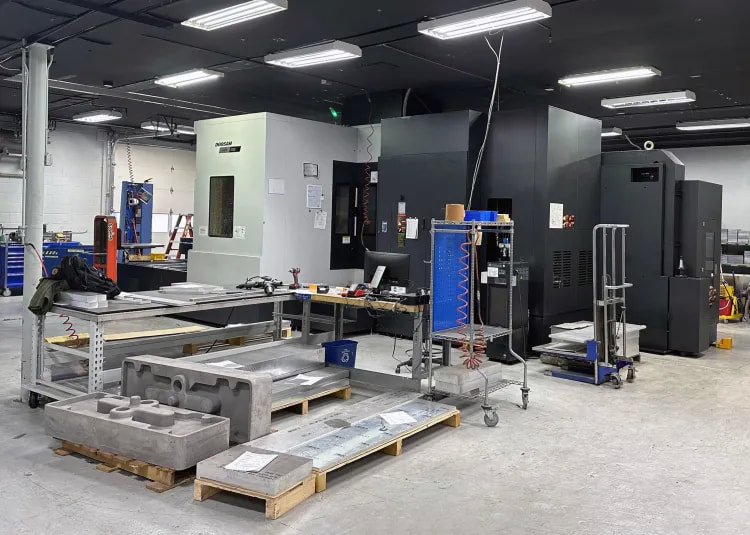 The upper chambers are machined using a Doosan HM 1000 horizontal machining center with CAT-50 spindle taper